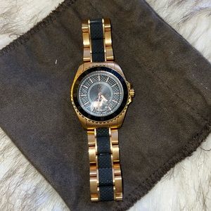 Authentic Guess Collection Swiss Made rose gold and black watch